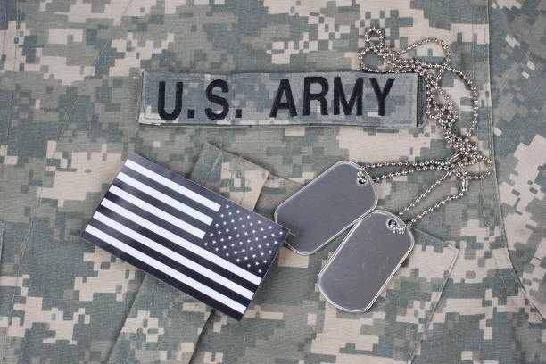 istock US flag patch with dog tag on Army Combat Uniform 1206314462