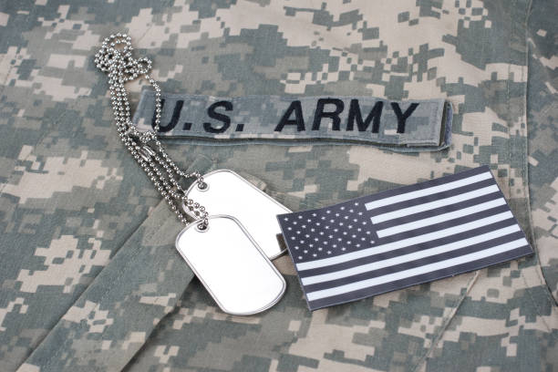 istock US flag patch with dog tag on Army Combat Uniform 1206314476
