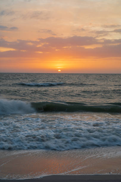 istock Sunset and clouds over the ocean at the beach 1206315518