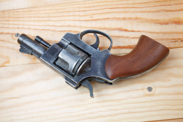 istock Revolver on the wooden table 1206318791