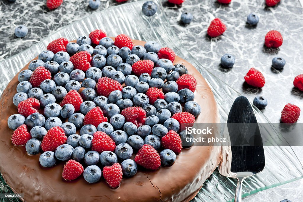 chocolate cake chocolate cake with raspberries and blueberries Blueberry Stock Photo