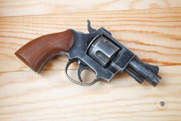 istock Revolver on the wooden table 1206318822