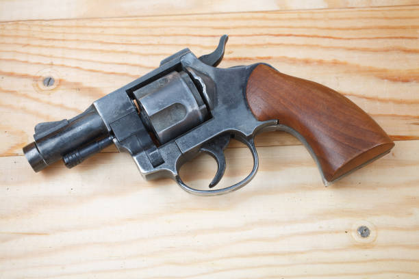 Revolver on the wooden table