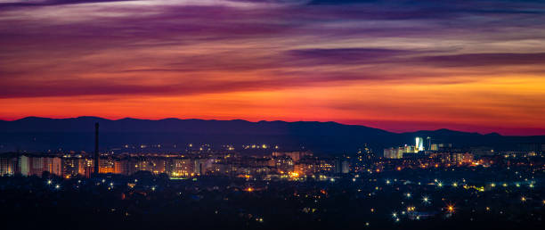 istock Beautiful sunset sky over the evening city 1206319299