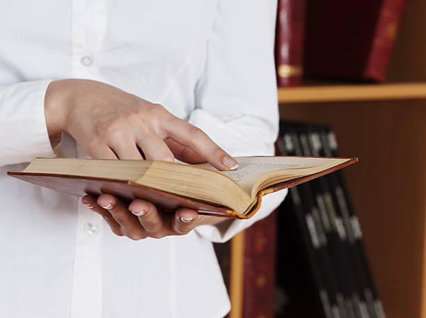 istock woman Hands holding ancient books 120631937