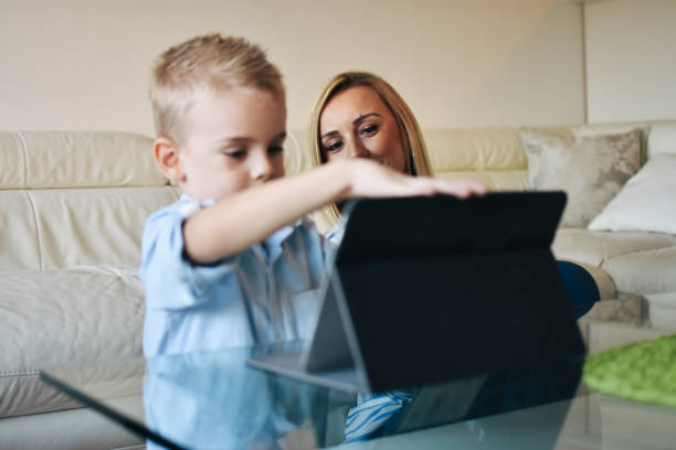 istock Mother and son with digital tablet 1206321140