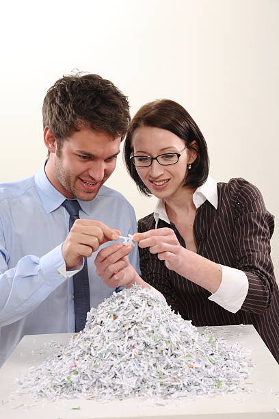 istock Man and Woman with file shredder 120632256