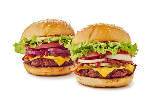 Two big hamburgers on white Two big hamburgers isolated on white. Clipping path included thick photos stock pictures, royalty-free photos & images