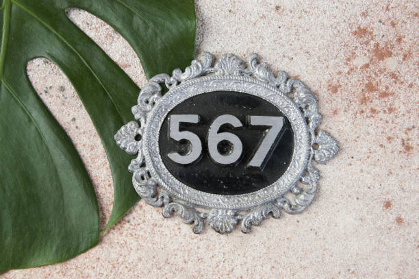 istock Antique door number on concrete background 1206324284
