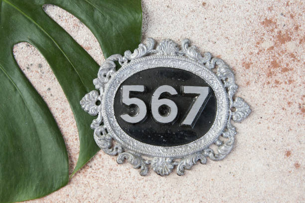 istock Antique door number on concrete background 1206324460