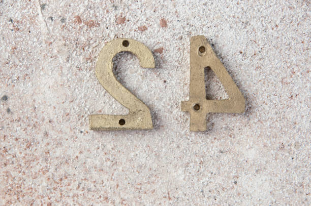 istock Antique door numbers on concrete background 1206324476