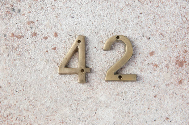 istock Antique door numbers on concrete background 1206324739