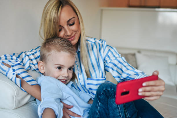 istock Young mother taking self portrait with smartphone 1206325406