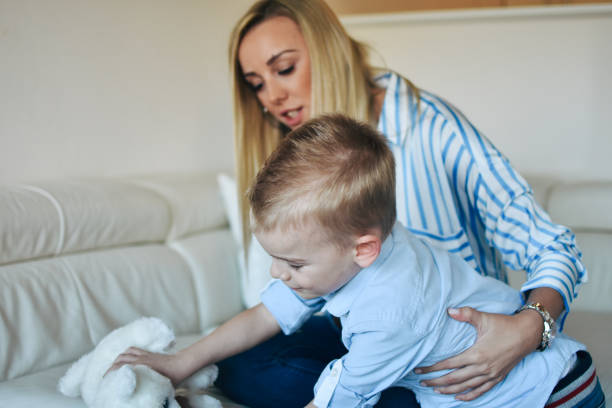 istock Happy mom plays with her son at home 1206325973