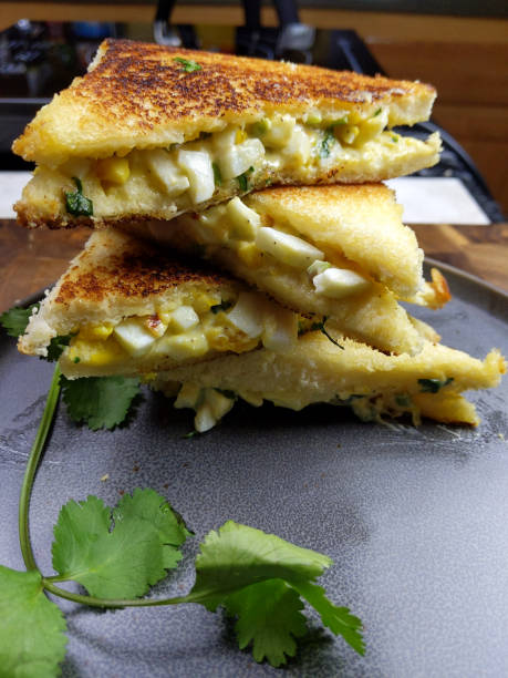 istock A stack of Bread and egg salad with mayonaise sandwich on a plate with copy space. 1206327483