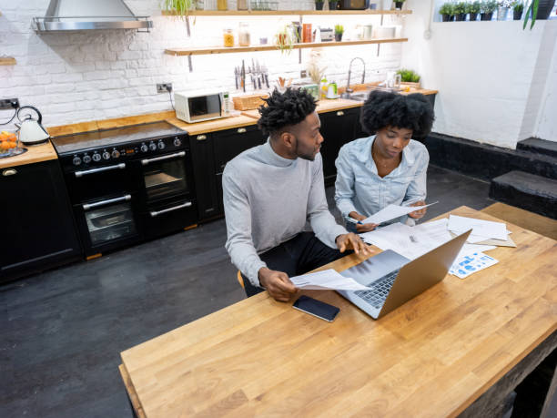 istock Black couple at home paying the bills online 1206327557