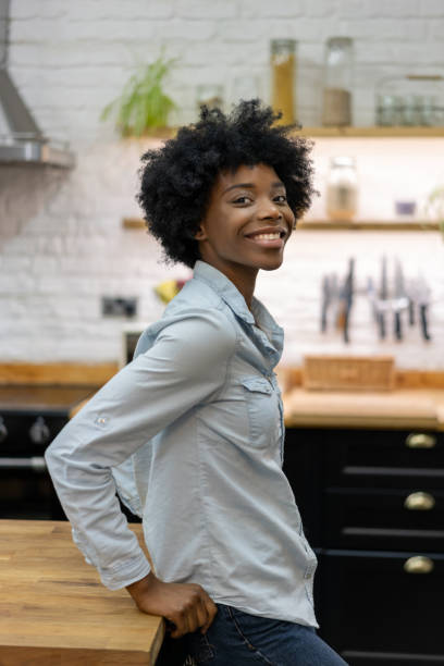 istock Happy black woman smiling at home 1206327601
