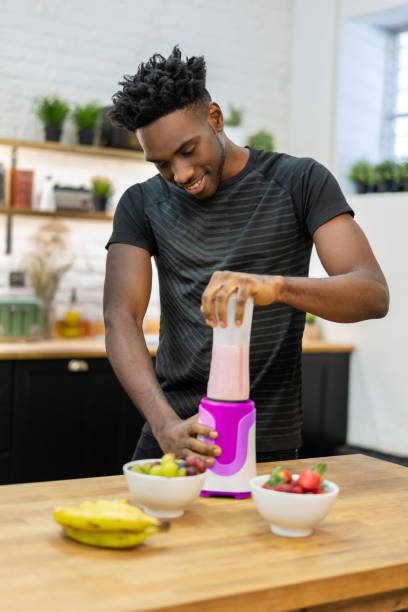 istock African American man at home making a healthy smoothie 1206327651