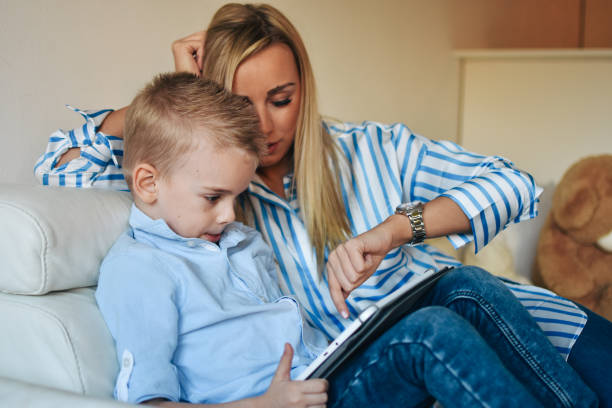 istock Mother and son with digital tablet 1206327758