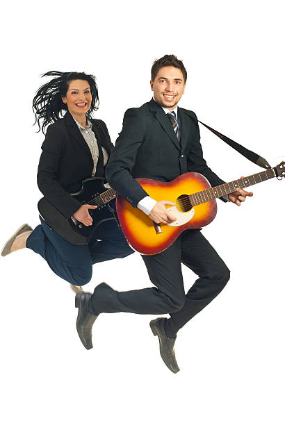 istock Business people jumping with guitars 120632944