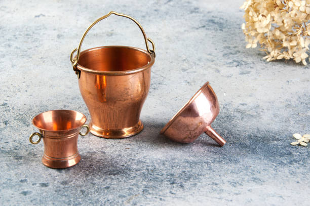 istock Set of 3 copper miniatures on concrete background 1206329665