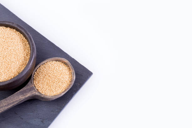 Amaranth seeds in wooden spoon (Amaranthus)