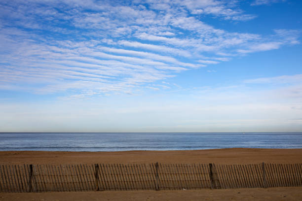 A wooden fence and beach in Rhode Island