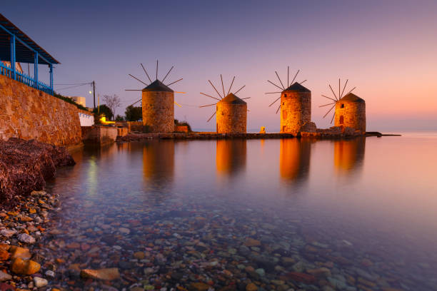 istock Sunrise image of the iconic windmills in Chios town. 1206332022