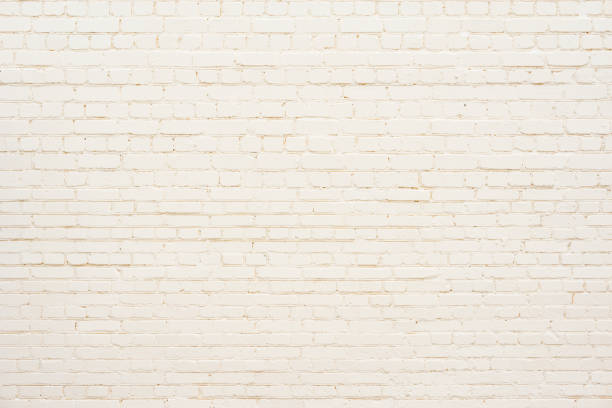 istock Old brick wall background painted in yellow. 1206332994