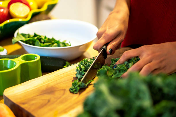 istock Latin woman cooking a salad for her diet 1206333069
