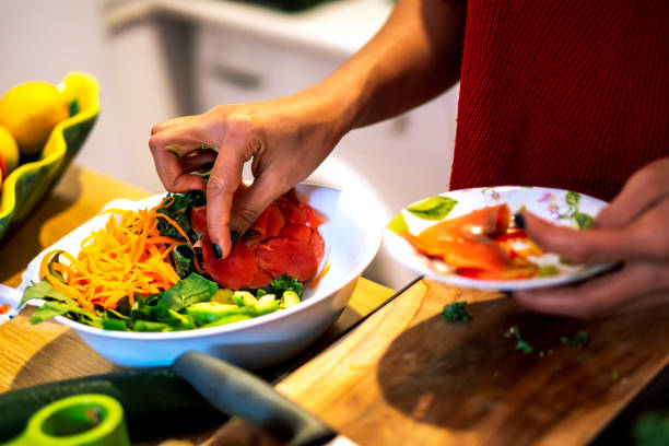 istock Latin woman cooking a salad for her diet 1206333075