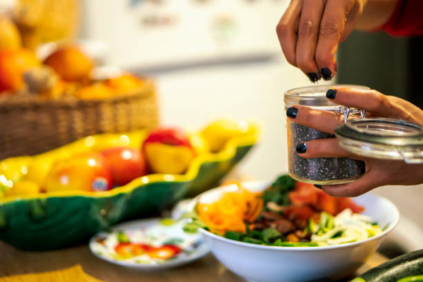 istock Latin woman cooking a salad for her diet 1206333084