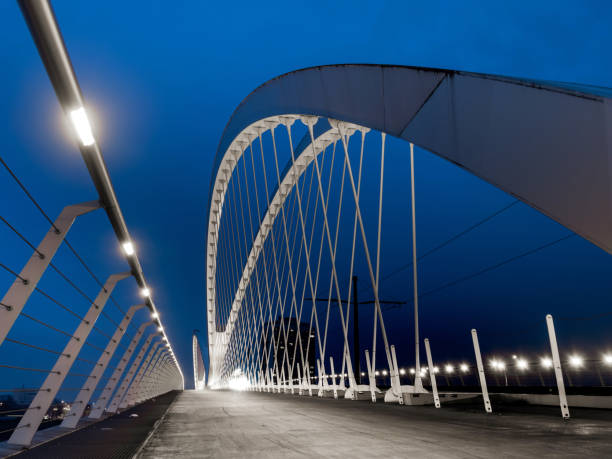 istock Lighted bridge between France and Germany at night. Pedestrian w 1206333088