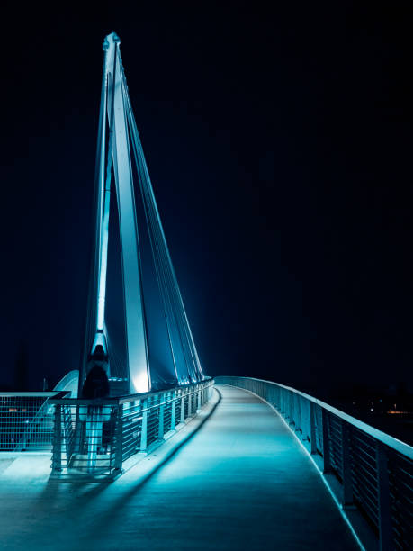 Lighted footbridge between France and Germany at night. Strasbou
