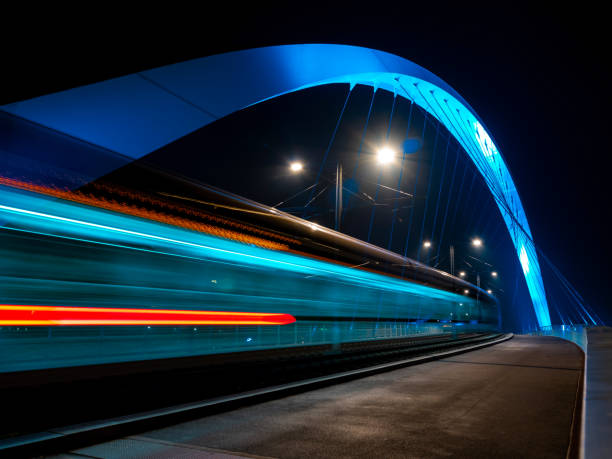 istock Lighted tram bridge at night. Strasbourg. Moving tram. Passerell 1206333092