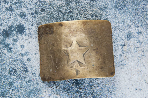 istock Old brass belt buckle with a star 1206333362