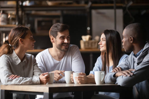 istock Diverse young people meeting in cafe drinking coffee 1206334672