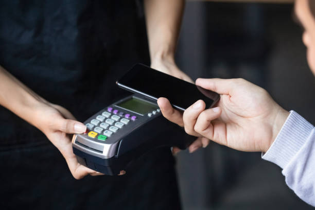 istock Close up of client paying on terminal with nfc technology 1206334681