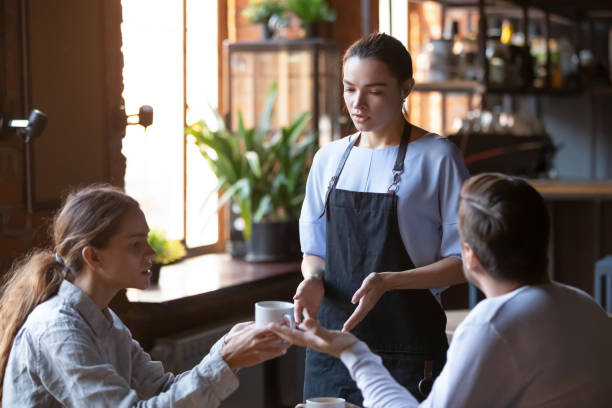 istock Angry client couple complain about bad service to waitress 1206334694