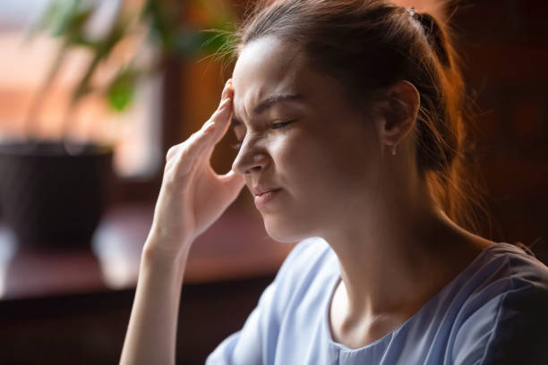 istock Young woman feel unwell suffering from strong headache 1206334750