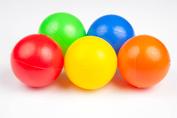 istock Colored plastic balls on white background. leisure and game items. round objects 1206345756