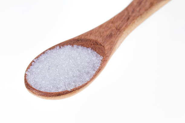 istock Spoon full of granulated sugar  on a white background 1206346899