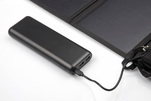 istock The solar panel charges the power bank battery for the smartphone on a white background. digital technologies and devices 1206350134
