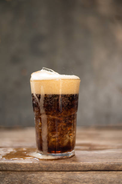 istock Ice cubes with soft drink on  dark background. 1206351378