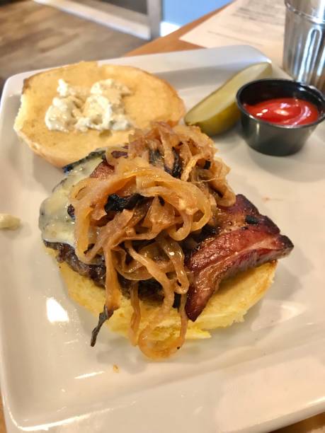 istock Burger on a bun with caramelized onions thick cut bacon and aioli sauce 1206358973
