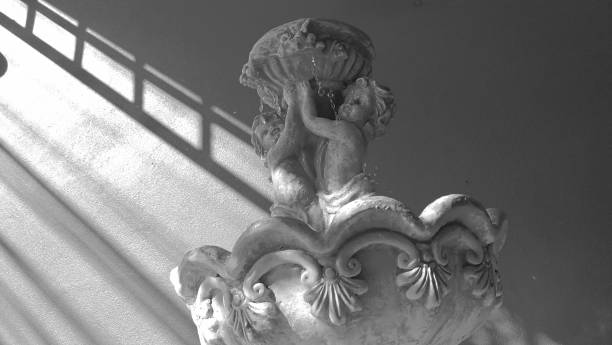 istock Two​ cupids​ fountain​.power​ of​ love​ concept 1206359733