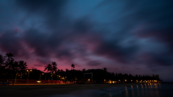 A night scape of the beach with buildings as a background