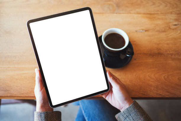istock a woman holding black tablet pc with blank white screen 1206363863