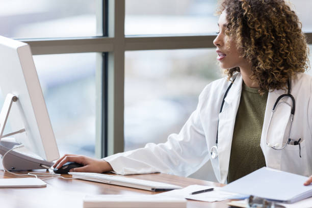 istock Female doctor concentrates while working in her office 1206365608