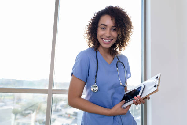 istock Smiling nurse looks at the camera 1206365663